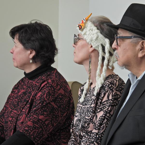 Dr. Deborah Saucier, VIU President, Aunalee Boyd-Good and her father, Ts’usquinuxn, William Good, who carved the Talking Stick