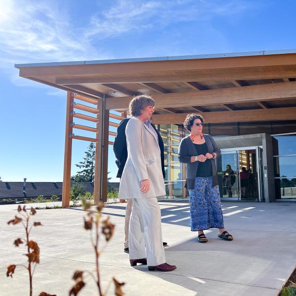 Sheila Malcolmson, MLA for Nanaimo, Richard Horbachewski and Lillian Morton tour the outside of Shq’apthut