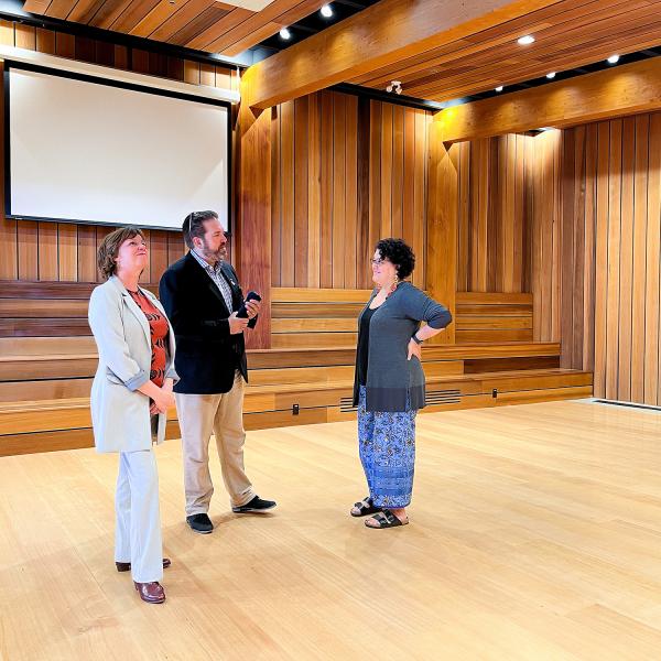 Sheila Malcolmson, MLA for Nanaimo, Richard Horbachewski and Lillian Morton tour the gathering space inside Shq’apthut