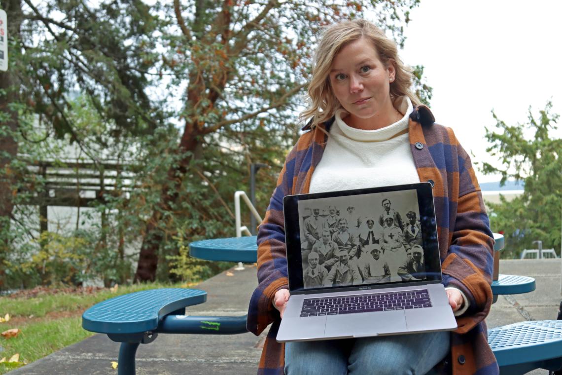 Danielle holds up a picture of WW1 nurses