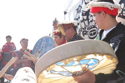 A group of men and boys with drums